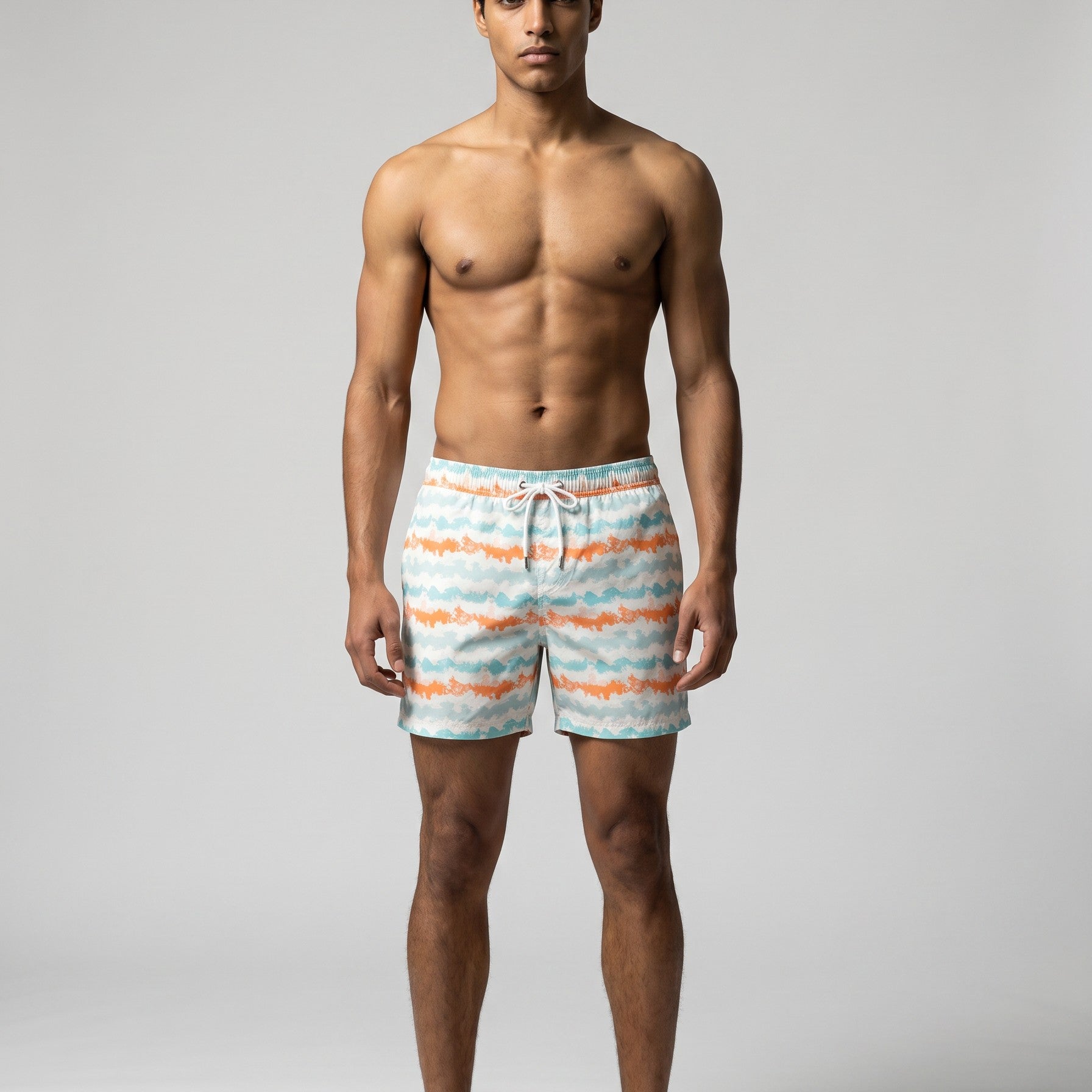 Man wearing coral and aqua Jack Rabbit Swims swim shorts